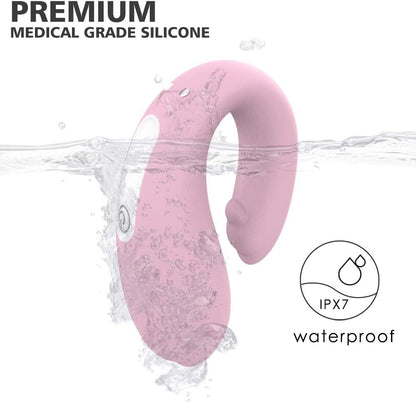 Premium medical grade silicone pink remote-controlled dolphin clitoral vibrator in water, IPX7 waterproof design.