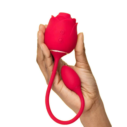 2-in-1 clitoral suction stimulator with egg vibrator in hand, featuring rose design and dual functions.