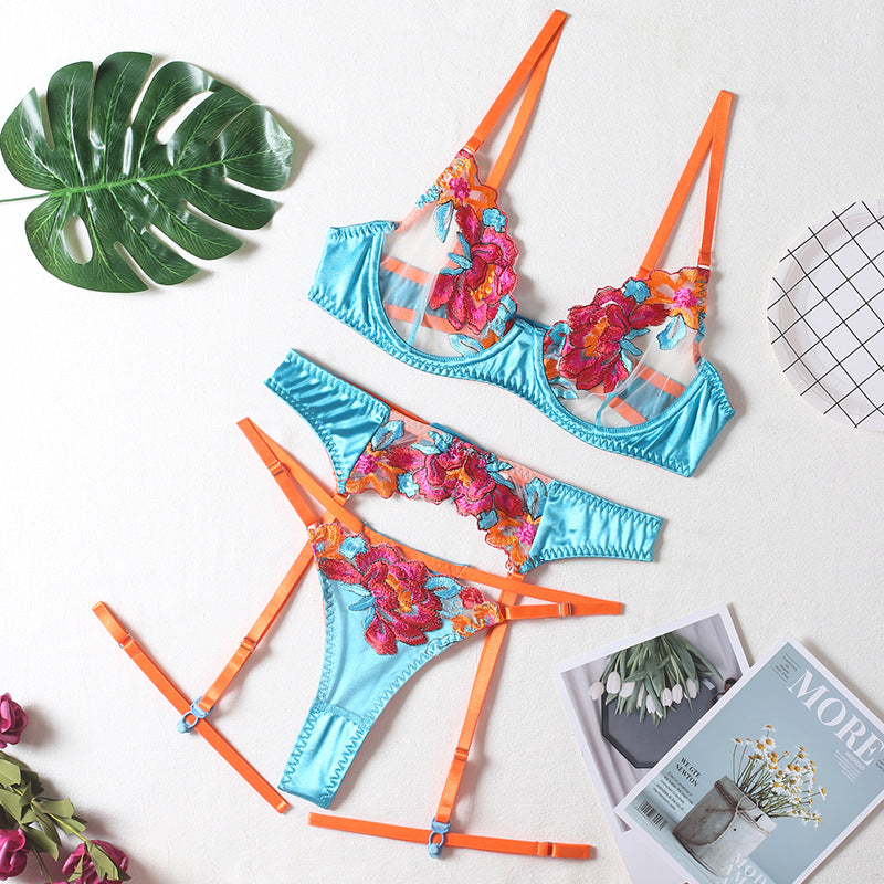 Seductive color-block embroidered floral bra set with underwire, garter belt, thigh garters, and crotchless panties.