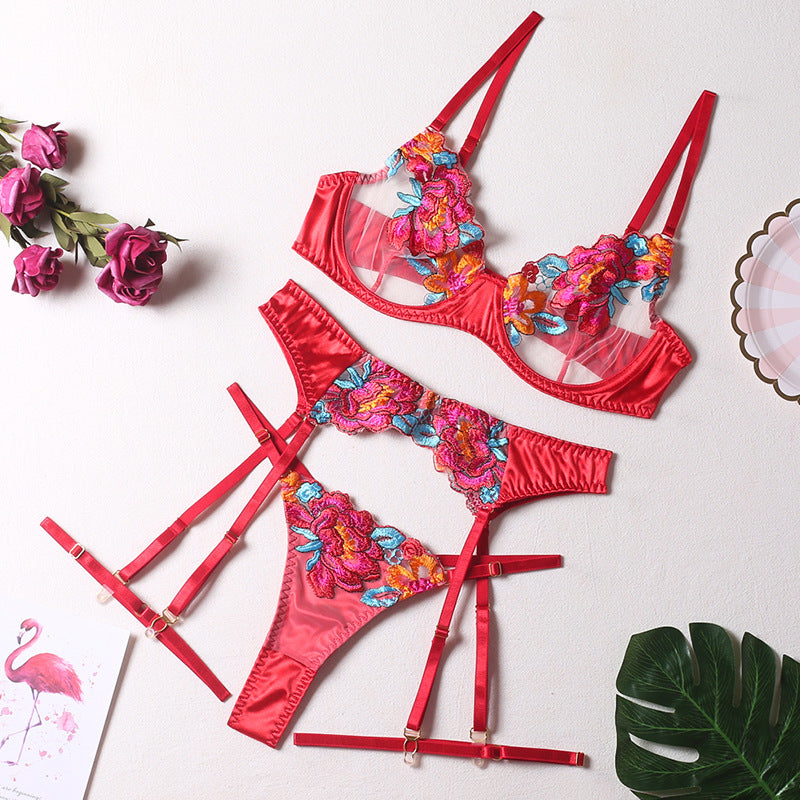 Seductive color-block embroidered floral bra set with underwire, garter belt, thigh garters, and crotchless panties.