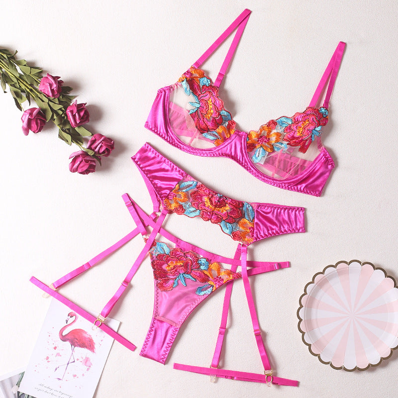 Seductive color-block embroidered floral bra set with underwire, garter belt, thigh garters, and crotchless panties.