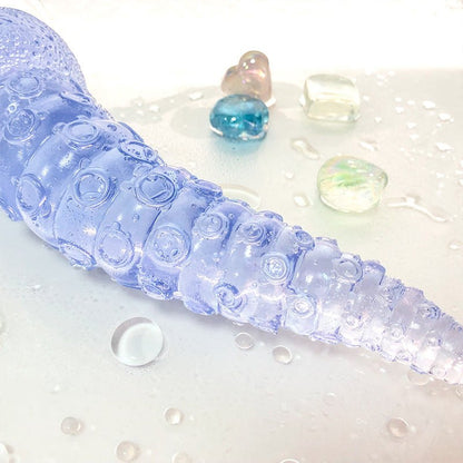 Octopus tentacle anal plug with realistic PVC shaft and beads in a waterproof silicone design.