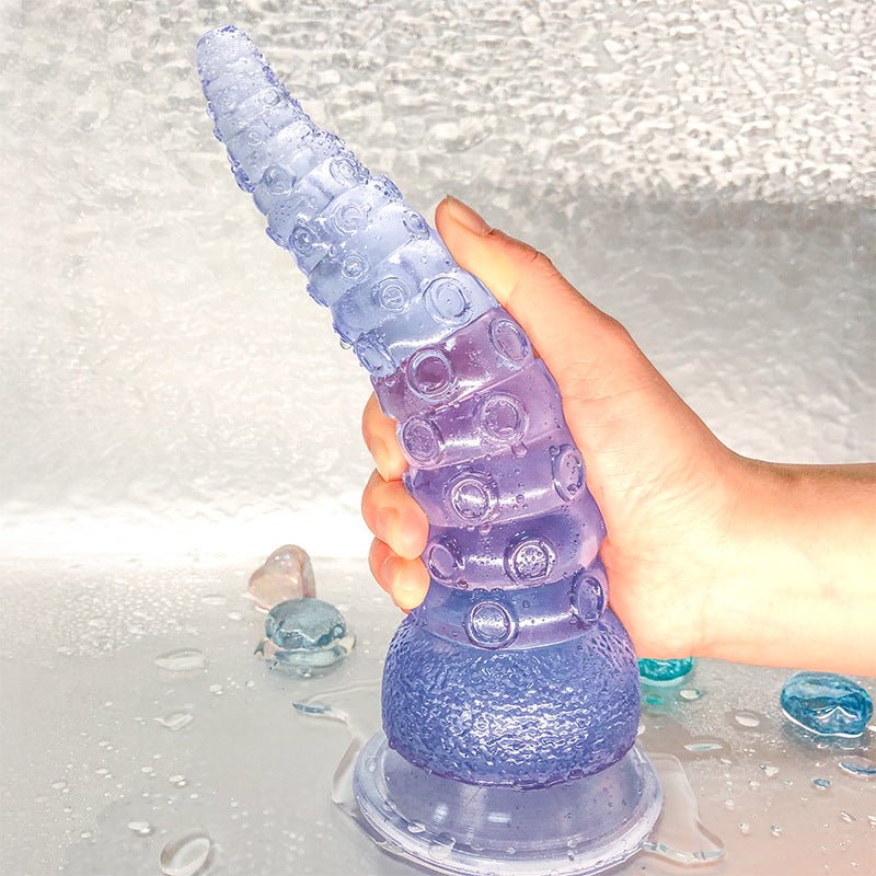 Octopus tentacle dildo anal plug with realistic PVC shaft and suction cup.