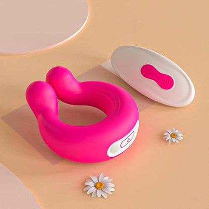Invisible wearable penis ring vibrator with remote control, pink silicone material, and magnetic charger.